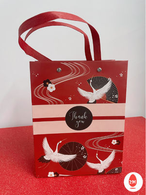 Coutume de emballage de sacs de cadeau de papier d'emballage de bande dessinée imprimée avec des poignées